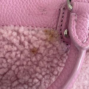 Small pink fuzzy coach crossover asking $75.00